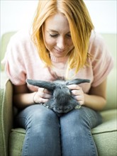 Woman stroking rabbit