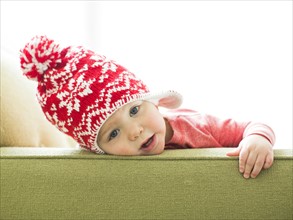 Baby boy (2-3) wearing knit hat