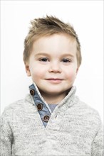 Baby boy (2-3) wearing sweater