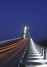 Illuminated bridge at dusk