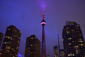 Illuminated city at dusk and CN Tower