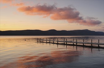 Jetty on lake at dawn