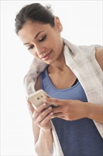 Young woman using smart phone.