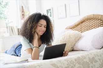 Teenage girl (16-17) using tablet pc.