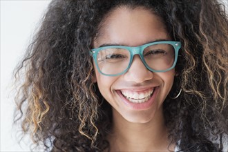 Portrait of teenage girl (16-17) wearing eyeglasses.