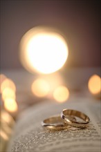 Wedding rings in open Bible.