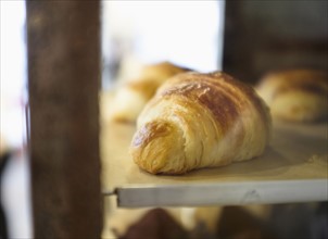 Close-up of croissant in bakery.