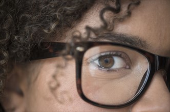 Close up of young woman in nerdy glasses.
