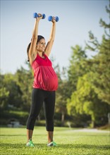 Pregnant woman exercising outdoors