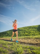 Woman running in field