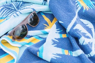 Sunglasses on towel