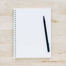 Overhead view of pen on notebook