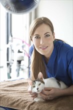 Portrait of vet with cat