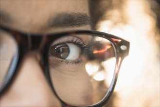 Close up of young woman in nerdy glasses.