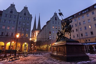 Equestrian statue on illuminated town square