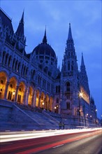 Illuminated Hungarian Parliament and light trails