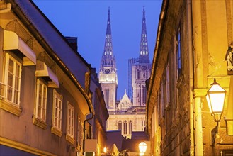 Illuminated street and spires of Zagreb Cathedral