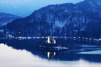 Lake Bled and illuminated Church of the Assumption on island