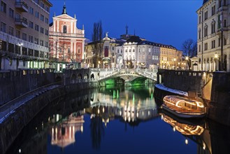 Illuminated buildings and Ljubljanica River