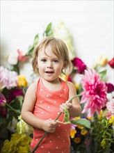 Portrait of little girl (2-3) with flower