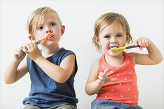 Children (2-3) brushing teeth