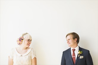 Smiling newlywed couple in studio