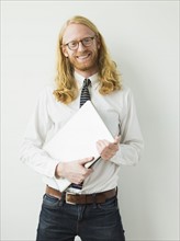 Portrait of smiling man with laptop