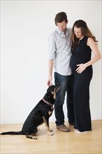 Portrait of couple with dog.