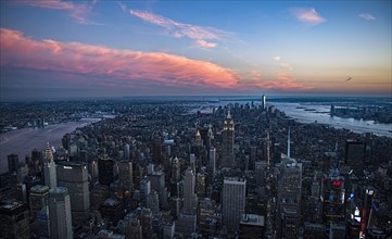 Aerial view of downtown district at sunset. USA, New York, New York City.