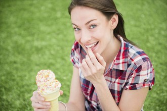 Portrait of woman eating ice cream cone