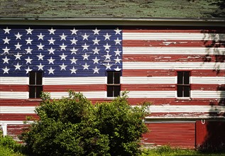 American flag painted on facade of barn