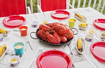 Plate with lobsters on dining table