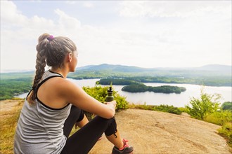 Young female hiker looking at view