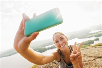 Young woman taking selfie on Smartphone