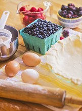Ingredients for berry pie on table