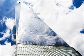 Low angle view of One World Trade Center against sky