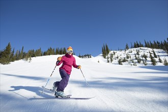 Woman skiing downhill