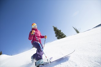 Woman skiing downhill