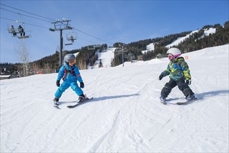 Little boys (4-5) learning skiing