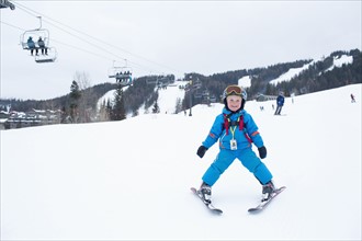 Smiley little boy (5) at ski resort