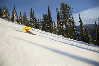 Low angle view of young man on ski slope