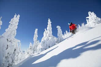 Low angle view of mature woman on ski slope
