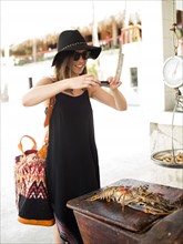 Woman taking photo of lobster