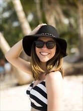 Portrait of woman smiling on beach