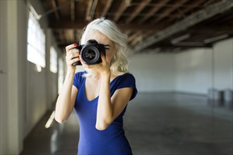 Woman using digital camera