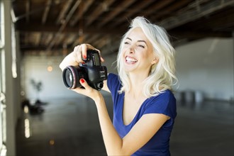 Woman using digital camera