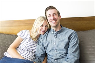 Portrait of mid adult couple at home