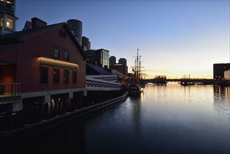 Ship and museum in Fort Point Channel at dawn