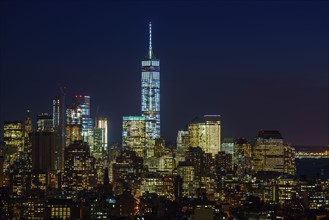 Illuminated cityscape with One world trade center at night. New York City, New York, USA.