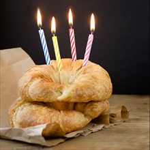 Croissants with birthday candles.